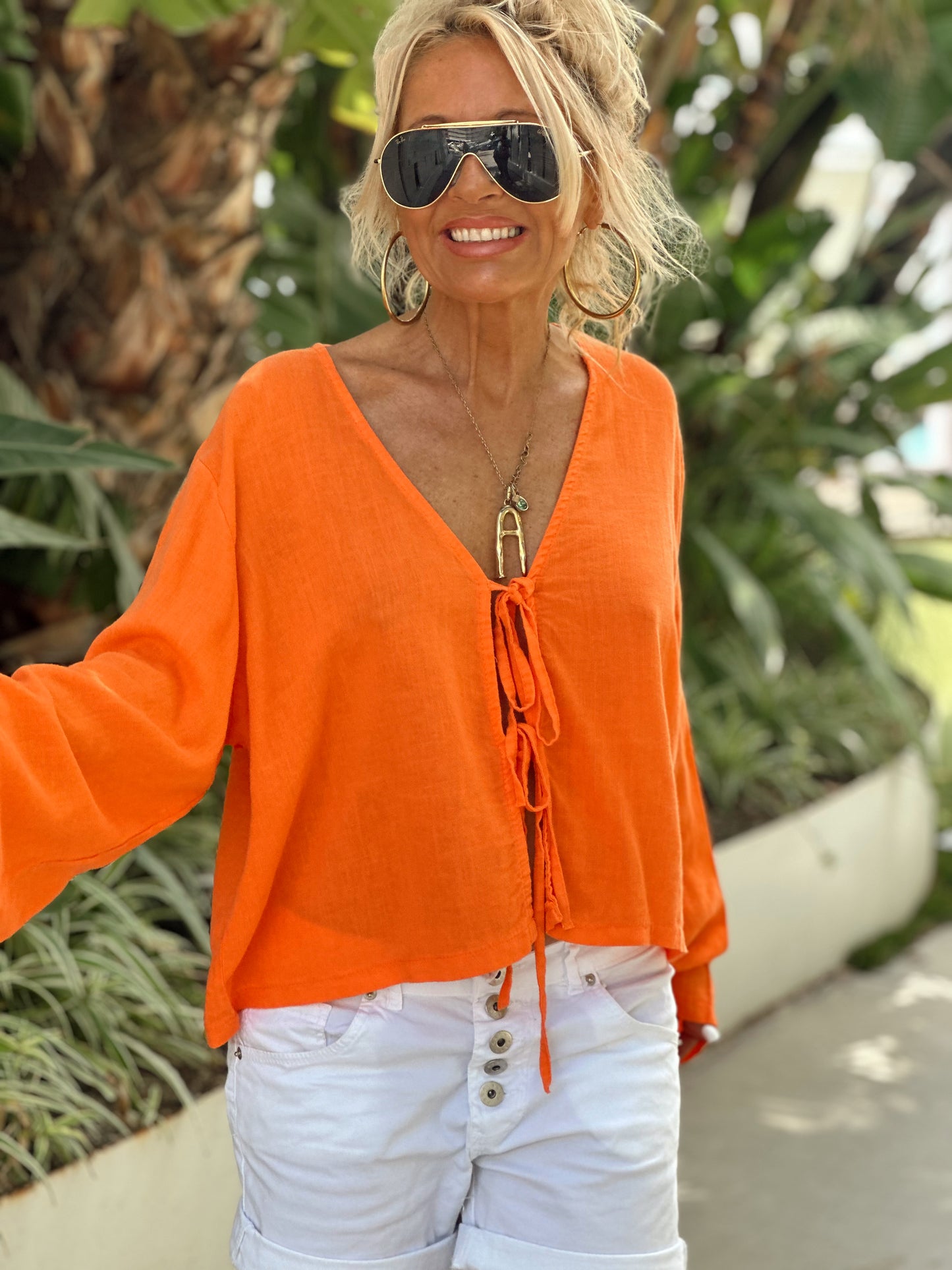 BLUSA CON LAZOS NARANJA