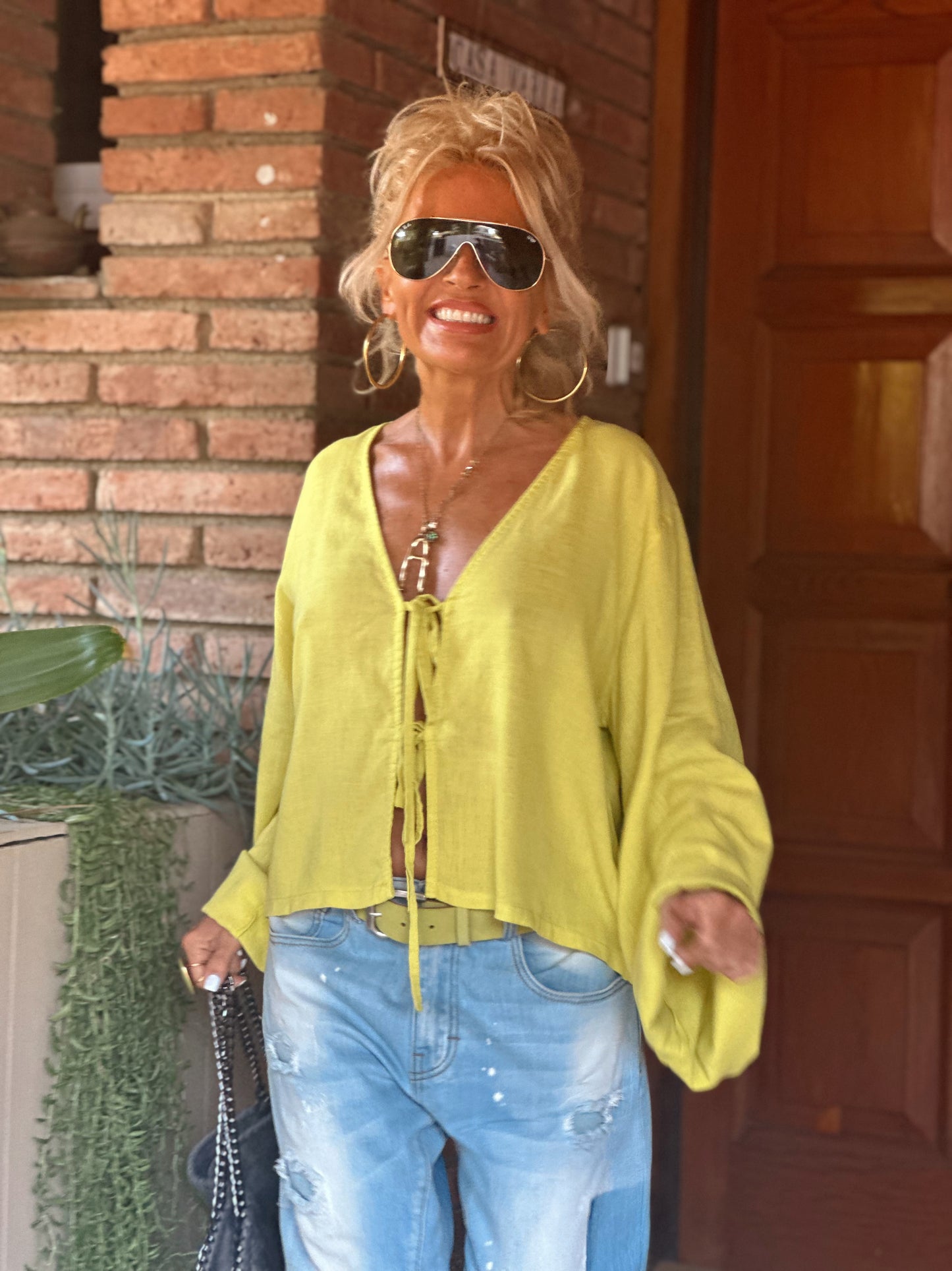 BLUSA CON LAZOS PISTACHO