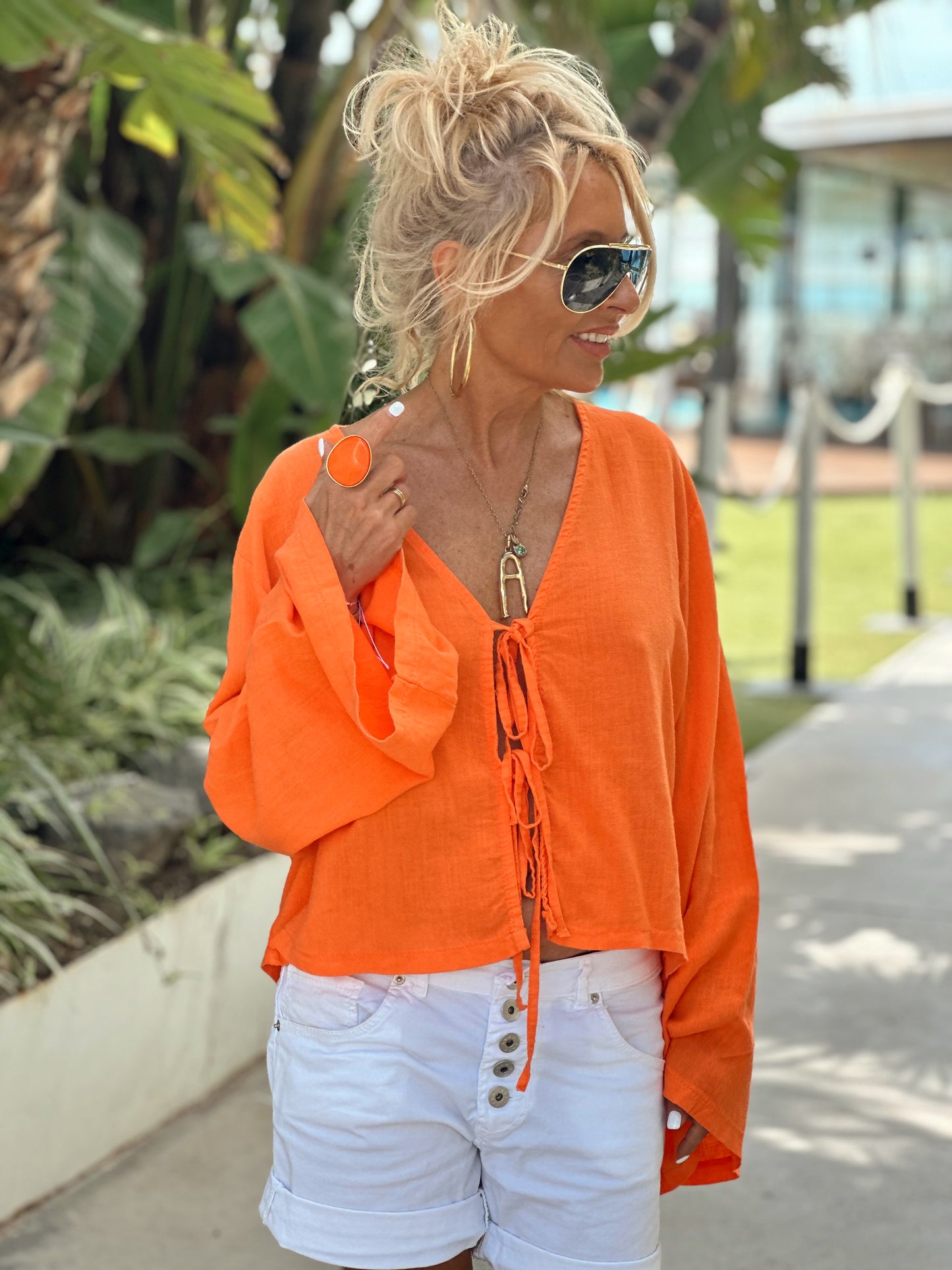 BLUSA CON LAZOS NARANJA