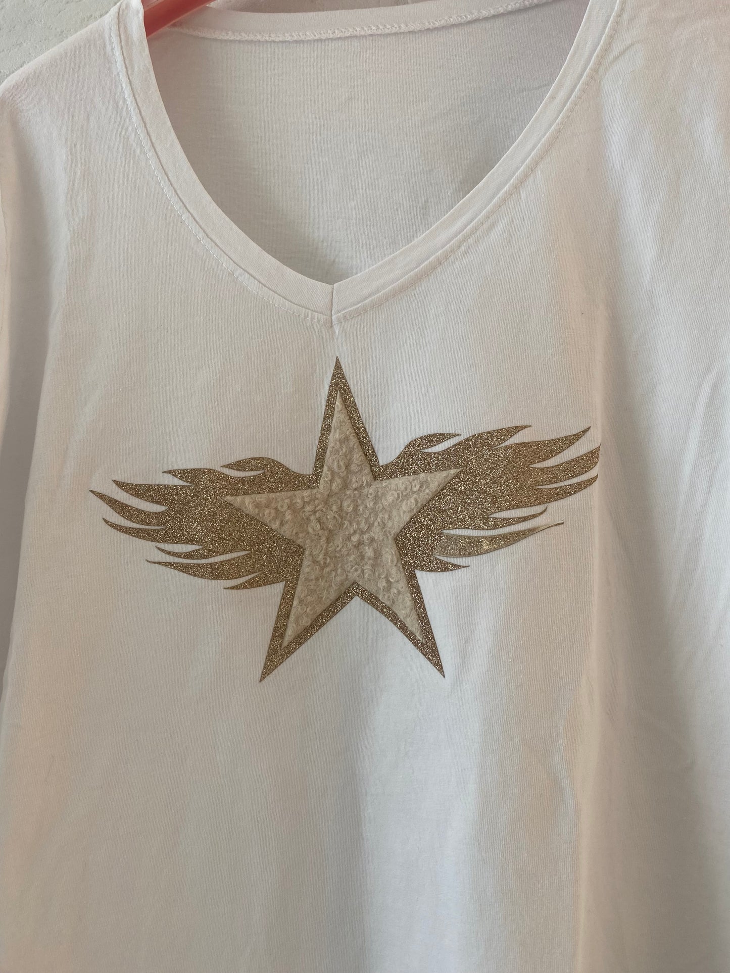 CAMISETA ESTRELLA CON ALAS